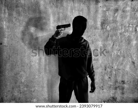 concept of black man wanting to kill himself with a gun. bullying, depression, frustration, suicide. focus on people