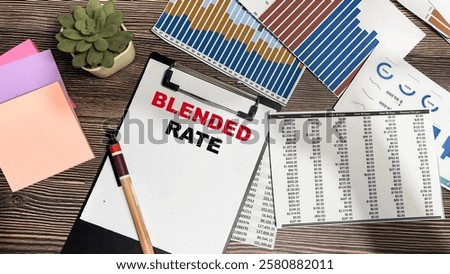 Concept of Blended rate write on paperwork isolated on Wooden Table.