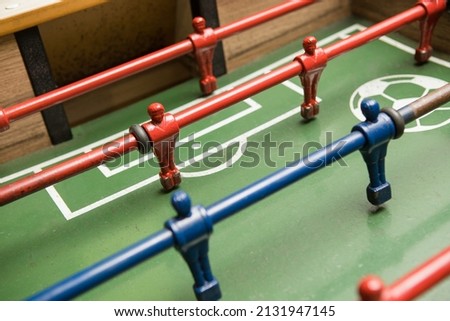 Concept of Board games. Table football game, Soccer table with red and blue players