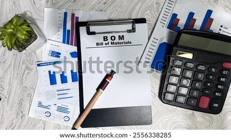 Concept of BOM - Bill of Materials write on paperwork isolated on Wooden Table.