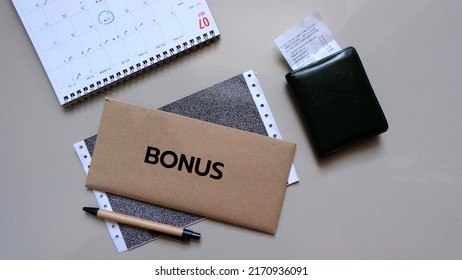 concept of bonus, communication by pulling paper of bonus from the envelope. - Shutterstock ID 2170936091