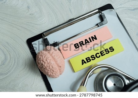 Concept of brain abscess write on sticky notes isolated on Wooden Table.