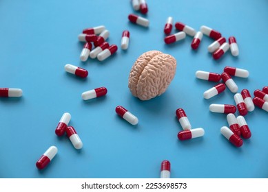Concept of brain diseases, mental health, Alzheimer's, Parkinson's disease, dementia, stroke, and seizure. Nootropics use to improve memory and neural function. Brain model with a pills.