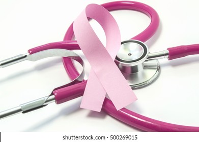 Concept Of Breast Cancer. Pink Ribbon Near The Pink-purple Stethoscope Doctor Of Breast Screening, Symbolizing The Diagnosis, Treatment, Fight, Awareness And Support  Of Women's Breast Cancer Close Up