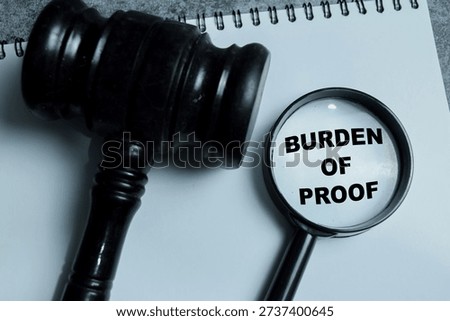 Concept of burden of proof write on book with isolated on Wooden Table. Showing legal responsibility, evidence requirement and obligation to prove claims in court