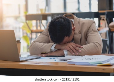 Concept Burnout Syndrome. Business man feels uncomfortable working. Which is caused by stress, accumulated from unsuccessful work And less resting body. Consult a specialist psychiatrist.