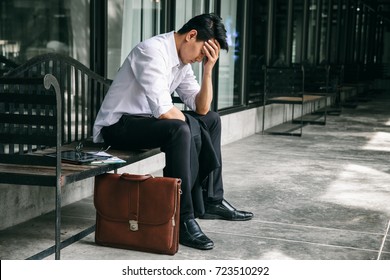 Concept Of Business Failure And Unemployment Problem.An Unemployed Businessman Sits Alone In The Corridor Of An Office. Is Stressed About The Future.