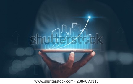 Concept of business prosperity and asset management, Real estate investment marketing analysis, Businessman holding mobile phone with graph of asset business growth, Planning to increase profits.