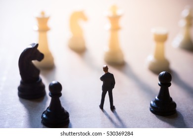 Concept Of Business Strategy. Businessman With A Chess Game.