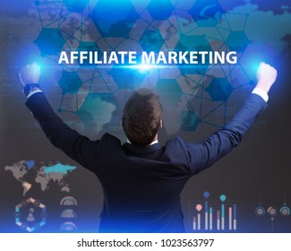 The concept of business, technology, the Internet and the network. Young businessman showing inscription: Affiliate marketing