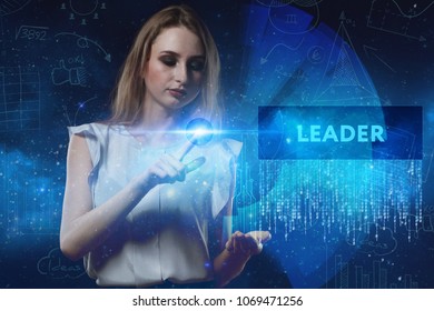 The concept of business, technology, the Internet and the network. A young entrepreneur working on a virtual screen of the future and sees the inscription: Leader