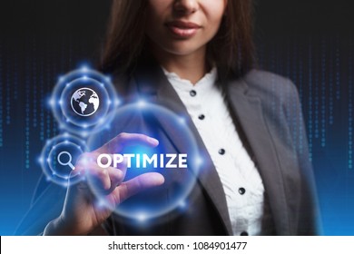 The concept of business, technology, the Internet and the network. A young entrepreneur working on a virtual screen of the future and sees the inscription: Optimize
