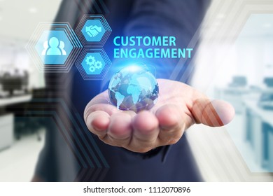 The concept of business, technology, the Internet and the network. A young entrepreneur working on a virtual screen of the future and sees the inscription: Customer engagement