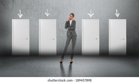 Concept of businesswoman choosing the right door - Powered by Shutterstock