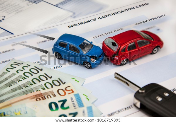 The concept of car insurance. Motor or car\
insurance application with car model with keys against the\
background of euros banknotes and insurance policy, braking\
distance and collision of\
vehicles