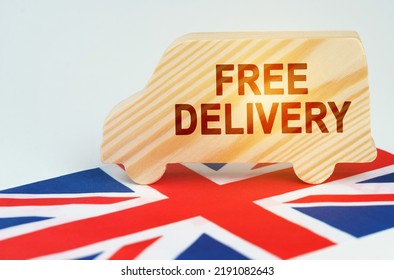 The concept of cargo transportation and logistics. On the flag of Great Britain there is a truck with an inscription - Free delivery