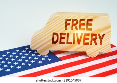 The concept of cargo transportation and logistics. On the US flag is a truck with the inscription - Free delivery