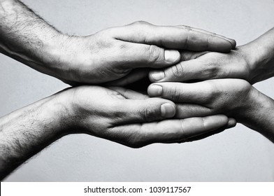 Concept of caring, tenderness, protection. Male and female hands touch each other. - Shutterstock ID 1039117567
