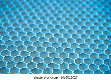 The concept of cells. Hexagonal cells in the future. Background with a repeating pattern. Blue pattern, resembling honeycombs. Grid pattern of hexagons.