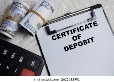 Concept of Certificate of Deposite write on paperwork isolated on Wooden Table.