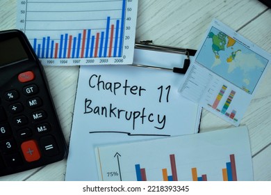 Concept of Chapter 11 Banktruptcy write on paperwork with statistics isolated on Wooden Table.