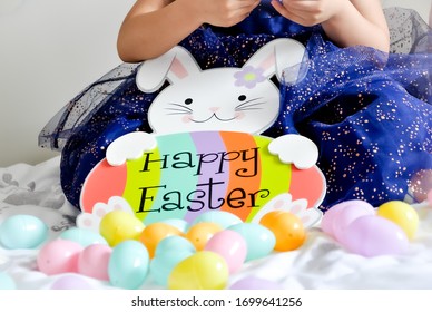 A Concept Of  Child Celebrating Easter Egg Hunt Inside The House