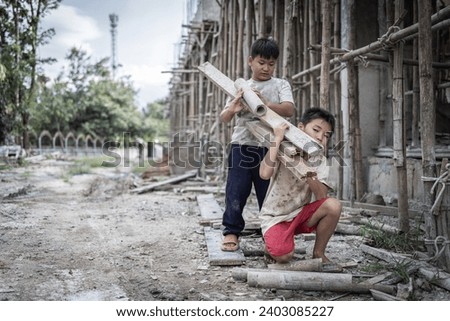 Concept of child labor, poor children being victims of construction labor, human trafficking, child abuse.