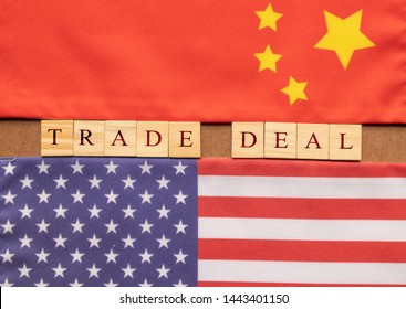 Concept Of China US Trade Deal, Trade Deal Printed On Wooden Block Letters In Between China And US Flags.