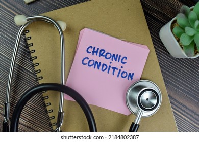 Concept Of Chronic Condition Write On Sticky Notes With Stethoscope Isolated On Wooden Table.