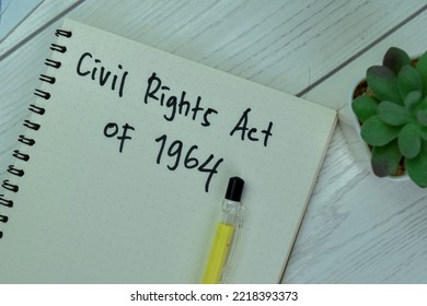 Concept Of Civil Rights Act Of 1964 Write On A Book Isolated On Wooden Table.