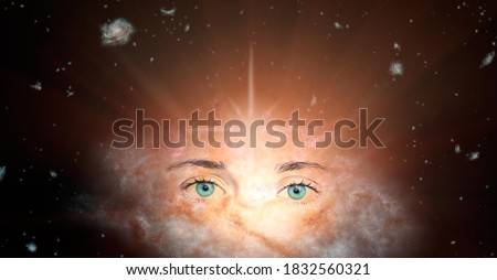 The concept of clairvoyance. Piercing green eyes looking into the future against the background of the galaxy. Paranormal abilities, clairvoyance, divination. Elements of this image are provided by