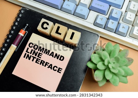 Concept of CLI - Command Line Interface write on sticky notes isolated on table.