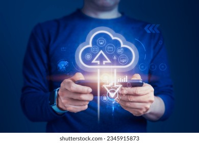 Concept of cloud computing technology as a Businessman connects devices to the cloud, the synergy of cloud computing and smartphones to stay connected and responsive from anywhere
