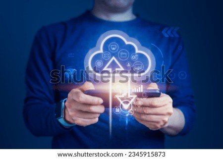 Concept of cloud computing technology as a Businessman connects devices to the cloud, the synergy of cloud computing and smartphones to stay connected and responsive from anywhere