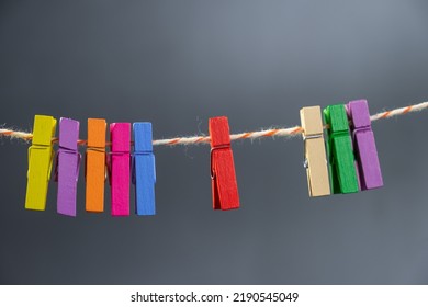 Concept Colored Wooden Clothespins On A Ropeclip Wooden Clothesline Colorful. Orange Green