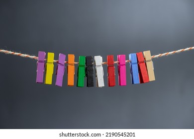 Concept Colored Wooden Clothespins On A Ropeclip Wooden Clothesline Colorful. Closeup Color