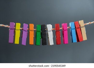 Concept Colored Wooden Clothespins On A Ropeclip Wooden Clothesline Colorful. Rope Closeup