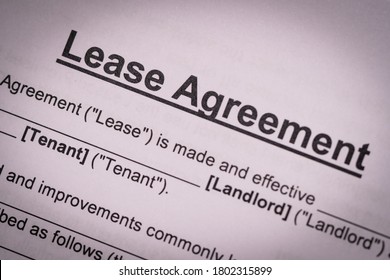 Concept Of Commercial, Lease, Tenancy, Contract, Property Or Commercial Laws: The Partial Of First Page Of Lease Agreement With Heavy Vignette.