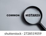 Concept of common mistakes write on book isolated on Wooden Table.