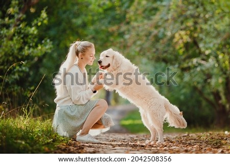 Similar – Image, Stock Photo Happy smiling dog with its pretty young owner