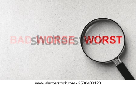 Concept of comparing quality and evaluation levels of business, customer service, or product. Worst wording in magnifying glass among worse and bad words on paper background.