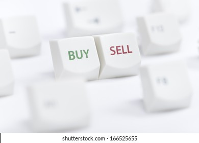Concept of computer keyboard button with buy sell text sign on white background