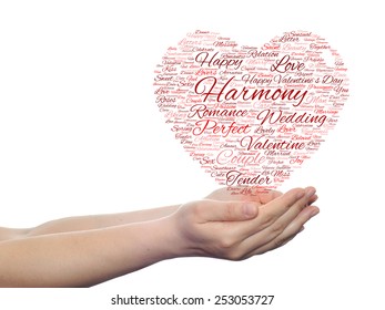 Concept or conceptual red wordcloud text in shape of heart symbol in hands isolated on white background, metaphor to love, romance, passion, romantic, emotion, marriage, valentine, desire or affection