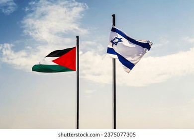 Concept of a Conflict between Isreal and the Palestinian. flags of Palestine and Israel on a blue background of cloudy sky. negotiations between Palestine and Israel concept. - Powered by Shutterstock