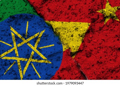 Concept Of A Conflict In The Ethiopian Region Of  Tigray With Painted Flags On A Rough Wall With A Crack