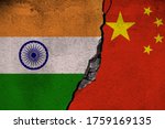 Concept of the conflictual Relations between India and China by Flags on a Wall with a Crack