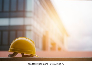 The concept of the construction industry Yellow engineer's hat with the morning light on a working day.
 - Shutterstock ID 2186613679