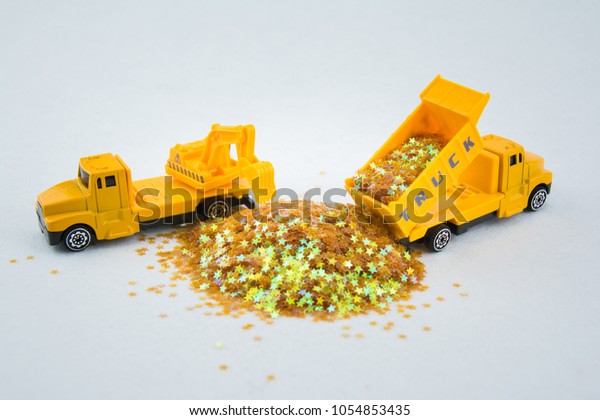 Concept of construction.  A truck and a Carrying\
crane truck are