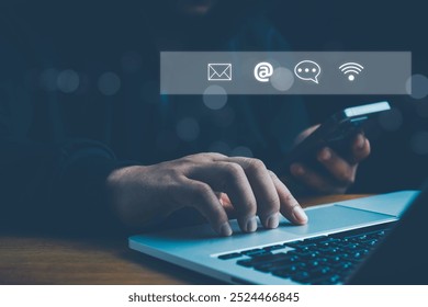 Concept of contact us, customer support, service, icon, Contact us or Customer support hotline people connect. Businessman using a laptop with the (email, call phone, mail) icons. customer service. - Powered by Shutterstock