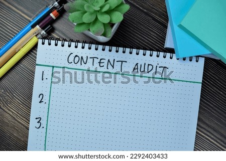 Concept of Content Audit write on book isolated on Wooden Table.